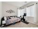 Cozy bedroom space with neutral decor and comfortable furnishings at 6726 N Palmer Estates St, North Las Vegas, NV 89086