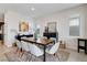 Elegant dining room with modern table, stylish chairs, and sophisticated decor at 6726 N Palmer Estates St, North Las Vegas, NV 89086