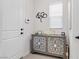 Elegant entryway featuring stylish mirrored cabinet and decor at 6726 N Palmer Estates St, North Las Vegas, NV 89086