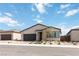Charming single-story home with a two-car garage and low-maintenance desert landscaping at 6726 N Palmer Estates St, North Las Vegas, NV 89086