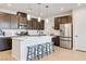Gorgeous kitchen with quartz countertops, stainless steel appliances, and lots of natural light at 6726 N Palmer Estates St, North Las Vegas, NV 89086