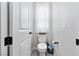 Clean and simple powder room with modern fixtures and neutral color palette at 6726 N Palmer Estates St, North Las Vegas, NV 89086
