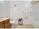 Bright bathroom with a combined shower and tub and oak vanity at 6745 Caporetto Ln # 104, North Las Vegas, NV 89084