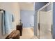 Modern bathroom with a glass shower and neutral-colored tiles at 6745 Caporetto Ln # 104, North Las Vegas, NV 89084