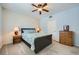 Cozy bedroom featuring carpeted floors, ceiling fan, and natural light at 6745 Caporetto Ln # 104, North Las Vegas, NV 89084