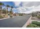 Gated Terrazzini community entrance with palm trees and a beautifully landscaped entrance at 6745 Caporetto Ln # 104, North Las Vegas, NV 89084