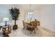 Cozy dining area with tile floors, a round table, and a decorative chandelier at 6745 Caporetto Ln # 104, North Las Vegas, NV 89084