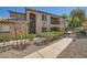 Inviting condominium exterior features a well-maintained facade, desert landscaping, and a private balcony at 6745 Caporetto Ln # 104, North Las Vegas, NV 89084