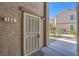 Charming front door entrance with security screen door and visible unit number at 6745 Caporetto Ln # 104, North Las Vegas, NV 89084