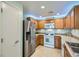 Contemporary kitchen with stainless steel refrigerator, tile backsplash, and ample cabinet space at 6745 Caporetto Ln # 104, North Las Vegas, NV 89084
