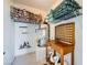 A storage area featuring shelves and place for water heater at 6745 Caporetto Ln # 104, North Las Vegas, NV 89084