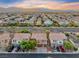 Picturesque aerial view of a suburban neighborhood with terracotta roofs and meticulously landscaped streets at 7479 Lassen Peak Cir, Las Vegas, NV 89149