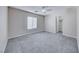Bedroom with neutral walls, plush carpeting, and a walk-in closet, offers a modern style at 7479 Lassen Peak Cir, Las Vegas, NV 89149