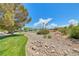 Landscaped park features lush green grass and desert xeriscape landscaping for sustainable beauty at 7479 Lassen Peak Cir, Las Vegas, NV 89149