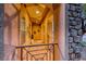 Welcoming front porch with stone columns, arched entryways, decorative vases, and geometric railings at 7479 Lassen Peak Cir, Las Vegas, NV 89149