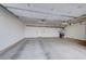 Spacious two-car garage with white walls, a concrete floor, and storage racks at 7479 Lassen Peak Cir, Las Vegas, NV 89149