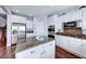 Well-equipped kitchen with stainless appliances, granite countertops, and a center island for food prep at 7479 Lassen Peak Cir, Las Vegas, NV 89149