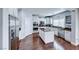 Modern kitchen featuring white cabinets, stainless steel appliances, and granite countertops at 7479 Lassen Peak Cir, Las Vegas, NV 89149