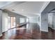 Open living area featuring hardwood floors, large sliding glass doors to the backyard, and neutral paint at 7479 Lassen Peak Cir, Las Vegas, NV 89149