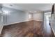 Bright living room with hardwood floors, large windows, neutral walls, and open space ready for decor at 7479 Lassen Peak Cir, Las Vegas, NV 89149