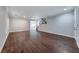 Open-concept living room with hardwood floors, natural light, and staircase leading to the second floor at 7479 Lassen Peak Cir, Las Vegas, NV 89149