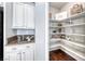 Spacious walk-in pantry with ample shelving for storage next to the kitchen cabinets at 7479 Lassen Peak Cir, Las Vegas, NV 89149