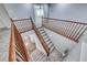 Carpeted staircase with wooden railing leads to the next level, enhancing the home's classic design at 7479 Lassen Peak Cir, Las Vegas, NV 89149