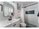 This renovated bathroom has white subway tile, a black framed mirror, and updated fixtures at 849 Parkhurst St, Las Vegas, NV 89110
