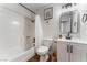 Updated bathroom features a tub/shower combo and stylish vanity with black hardware at 849 Parkhurst St, Las Vegas, NV 89110