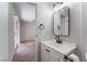 This bathroom offers a stylish vanity, updated fixtures, and a mirror at 849 Parkhurst St, Las Vegas, NV 89110