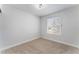 Bedroom with neutral carpet, window and fresh neutral paint at 849 Parkhurst St, Las Vegas, NV 89110