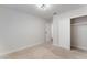 This bedroom features neutral carpet, a light fixture, and a closet for essential storage at 849 Parkhurst St, Las Vegas, NV 89110