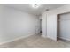 A bright, neutral carpeted bedroom featuring a closet at 849 Parkhurst St, Las Vegas, NV 89110