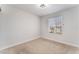 Neutral bedroom with carpet, one window and simple light fixture at 849 Parkhurst St, Las Vegas, NV 89110