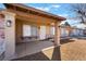 Charming covered front porch with decorative columns, brick accents, and security screen door at 849 Parkhurst St, Las Vegas, NV 89110