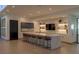 Modern bar area features ample seating, sleek countertops, and a built-in entertainment center at 912 Calluna Hills Ln, Las Vegas, NV 89138