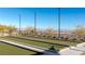 Bocce ball court featuring beautiful landscaping and lighting, providing a leisurely outdoor activity at 912 Calluna Hills Ln, Las Vegas, NV 89138