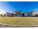 Expansive community clubhouse surrounded by lush lawn and modern outdoor seating areas at 912 Calluna Hills Ln, Las Vegas, NV 89138