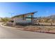 Community entrance featuring modern architecture, desert landscaping, and clear signage for Heritage at Stonebridge at 912 Calluna Hills Ln, Las Vegas, NV 89138