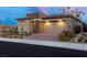 Attractive single-story home featuring stone accents and a spacious two-car garage at 912 Calluna Hills Ln, Las Vegas, NV 89138
