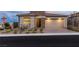 Charming single-story home featuring a stone facade and a two-car garage with brick paver driveway at 912 Calluna Hills Ln, Las Vegas, NV 89138