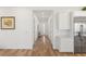 Bright, neutral hallway features wood floors and leads to the home's entry at 912 Calluna Hills Ln, Las Vegas, NV 89138
