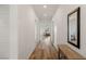 Inviting hallway with wood floors, leading to the living area, with an elegant console table and mirror at 912 Calluna Hills Ln, Las Vegas, NV 89138