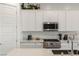 Bright kitchen featuring white cabinets, stainless steel appliances, and a functional layout at 912 Calluna Hills Ln, Las Vegas, NV 89138