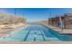 Resort-style lap pool with lounge chairs, offering a luxurious and relaxing experience at 912 Calluna Hills Ln, Las Vegas, NV 89138