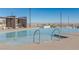 Upscale pool with modern lounge area, offering stunning views of the surrounding landscape at 912 Calluna Hills Ln, Las Vegas, NV 89138