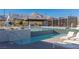 Community pool with lounge chairs and mountain views, perfect for relaxation and entertainment at 912 Calluna Hills Ln, Las Vegas, NV 89138