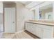 Bathroom featuring double sinks, granite countertops, and white cabinets with modern fixtures at 9130 Haddington Ln, Las Vegas, NV 89145