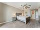 Comfortable bedroom with a neutral color palette, ceiling fan, and wood-look flooring at 9130 Haddington Ln, Las Vegas, NV 89145