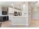 Bright kitchen with stainless steel appliances, modern pendant lights, and a breakfast bar at 9130 Haddington Ln, Las Vegas, NV 89145